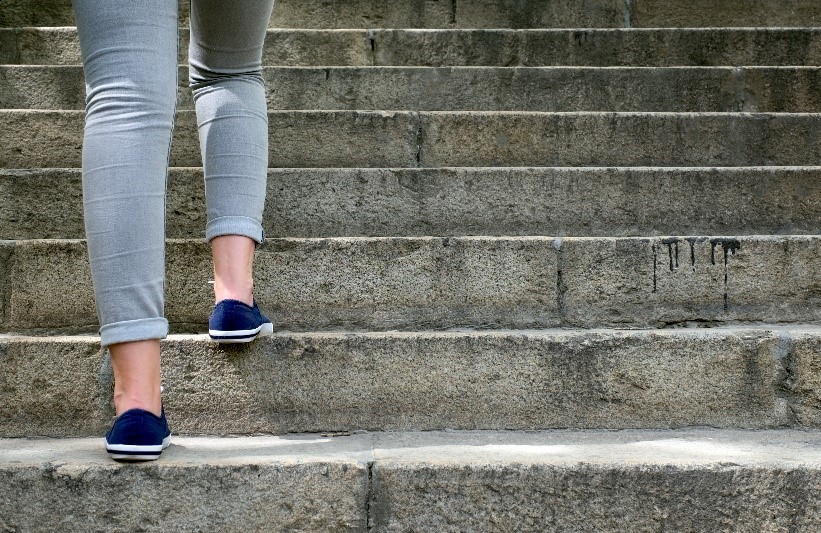 person walking up steps